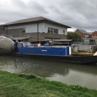Exbury Egg towed by C&RT barge along Grand Union Canal
